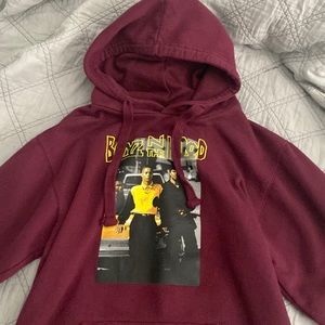 A hoodie it’s worm hand made color is maroon red and size SMALL